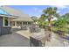 Charming outdoor seating area with views of the lake, perfect for relaxation at 645 Retreat Beach Circle # A-2-C, Pawleys Island, SC 29585
