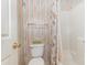 Bathroom with a toilet, bathtub, and a seashell-patterned shower curtain at 665 Tupelo Ln. # 17-F, Longs, SC 29568