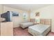 Bedroom with two twin beds, a window view, and a vintage television set at 665 Tupelo Ln. # 17-F, Longs, SC 29568