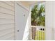 Unit F entrance features a white door and a peek at the inviting outdoor area with a palm tree at 665 Tupelo Ln. # 17-F, Longs, SC 29568