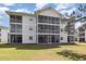 The screened-in patios add a lot to this multi-story condo, as seen from the lawn at 665 Tupelo Ln. # 17-F, Longs, SC 29568