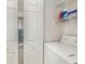 Dedicated laundry area equipped with shelving for organized storage and convenience at 665 Tupelo Ln. # 17-F, Longs, SC 29568