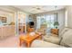 Living room with a sofa, armchair, coffee table, and sliding doors to a balcony at 665 Tupelo Ln. # 17-F, Longs, SC 29568