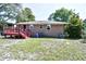 Back of house with deck, brick and yard waste bins at 703 S 21St Ave. S, North Myrtle Beach, SC 29582