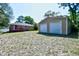 Backyard with storage shed and view of the house, under sunny skies at 703 S 21St Ave. S, North Myrtle Beach, SC 29582
