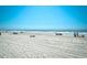 Serene ocean view of sandy beach with people relaxing on a sunny day at 703 S 21St Ave. S, North Myrtle Beach, SC 29582