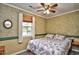 Charming bedroom featuring a ceiling fan, window and coral seashell bedding at 703 S 21St Ave. S, North Myrtle Beach, SC 29582