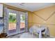 Bright dining area featuring a table with seating for four, with backyard access through glass doors at 703 S 21St Ave. S, North Myrtle Beach, SC 29582