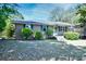 Quaint single-story brick residence complemented by well-maintained shrubbery and a cozy facade at 703 S 21St Ave. S, North Myrtle Beach, SC 29582