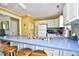 Open kitchen area featuring white cabinets, a blue countertop island, and a stainless steel sink at 703 S 21St Ave. S, North Myrtle Beach, SC 29582