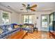 Cozy living room featuring comfortable seating, natural light, and parquet wood flooring at 703 S 21St Ave. S, North Myrtle Beach, SC 29582