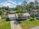 Aerial view of the charming single-Gathering home with a well-maintained lawn, mature trees, and a metal roof at 706 Chippendale Dr., Myrtle Beach, SC 29588