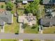Aerial view of a house with a well-maintained lawn, a long driveway, and mature trees at 706 Chippendale Dr., Myrtle Beach, SC 29588