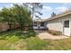 Inviting backyard features a fire pit, a screened-in porch, and lush landscaping, creating an ideal outdoor retreat at 706 Chippendale Dr., Myrtle Beach, SC 29588