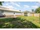 Spacious backyard with a fire pit, and built in bar, offering ample space for outdoor activities and entertaining guests at 706 Chippendale Dr., Myrtle Beach, SC 29588