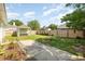 Spacious backyard featuring a fire pit, built-in bar, and lush greenery, perfect for outdoor enjoyment and relaxation at 706 Chippendale Dr., Myrtle Beach, SC 29588