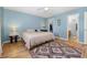 Charming bedroom with light blue walls, a ceiling fan, and a decorative area rug at 706 Chippendale Dr., Myrtle Beach, SC 29588