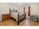 Inviting bedroom featuring wood floors, and a large ornate bed frame at 706 Chippendale Dr., Myrtle Beach, SC 29588