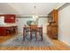 Cozy dining room with a wooden dining table set, overhead chandelier, and rustic hutch at 706 Chippendale Dr., Myrtle Beach, SC 29588