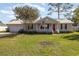 Charming single-story home with well-maintained lawn, front porch, and attached garage at 706 Chippendale Dr., Myrtle Beach, SC 29588