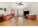 Spacious living room with wood laminate floors, vaulted ceiling, and plenty of natural light at 706 Chippendale Dr., Myrtle Beach, SC 29588