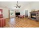 Spacious living room with a fireplace, wood laminate floors, and ample natural light at 706 Chippendale Dr., Myrtle Beach, SC 29588