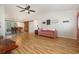 Bright living room with wood laminate floors, vaulted ceiling, and views of the dining area at 706 Chippendale Dr., Myrtle Beach, SC 29588