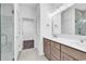Elegant bathroom with double vanity, large mirror, and sleek shower doors, providing a luxurious feel at 718 Highway 348, Loris, SC 29569