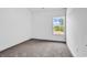 Bright bedroom with large window and plush carpet at 718 Highway 348, Loris, SC 29569