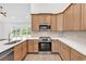 Well-appointed kitchen with stainless appliances, granite countertops, and natural light from sliding glass doors at 718 Highway 348, Loris, SC 29569