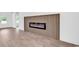 Stylish living room features an elegant fireplace with a modern linear design and beautiful flooring at 718 Highway 348, Loris, SC 29569