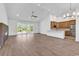 Spacious living room with wood floors, a fireplace, and natural light at 718 Highway 348, Loris, SC 29569