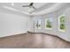 Bright main bedroom with large windows and a ceiling fan offers lots of natural light at 718 Highway 348, Loris, SC 29569