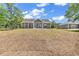 Single-story home features large sliding glass doors to a spacious backyard at 718 Highway 348, Loris, SC 29569