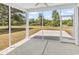 Screened-in porch provides serene views of the backyard and surrounding lush landscape at 718 Highway 348, Loris, SC 29569