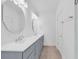 Bathroom featuring dual sinks, decorative mirrors, and modern fixtures at 722 Highway 348, Loris, SC 29569