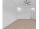Spacious bedroom with ample natural light, complemented by neutral walls, modern fan and light hardwood floors at 722 Highway 348, Loris, SC 29569