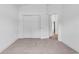 Bright bedroom featuring neutral carpet, white trim and doors, and a double closet at 722 Highway 348, Loris, SC 29569