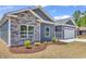 Close-up of a home's exterior with stone accents, landscaping, and modern design at 722 Highway 348, Loris, SC 29569