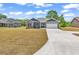 Inviting single-story home with a two-car garage and beautifully maintained lawn at 722 Highway 348, Loris, SC 29569
