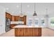 Bright kitchen with wooden cabinets, stainless steel appliances, and a large island with a white countertop at 722 Highway 348, Loris, SC 29569