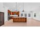 Open concept kitchen with wood cabinets, island, stainless steel appliances, and pendant lighting at 722 Highway 348, Loris, SC 29569