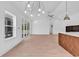 Open concept living room with sliding glass doors, modern lighting, and kitchen with island at 722 Highway 348, Loris, SC 29569