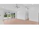Bright living room with light wood floors and sliding glass doors leading to a patio at 722 Highway 348, Loris, SC 29569