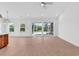 Bright living room with wood floors, sliding glass doors, and modern ceiling fan at 722 Highway 348, Loris, SC 29569