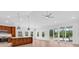 Open-concept living area with modern kitchen, island, and seamless access to the outdoor patio at 722 Highway 348, Loris, SC 29569