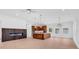 Open-concept living space with modern fireplace, kitchen island, and wood cabinets at 722 Highway 348, Loris, SC 29569