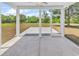 Cozy screened-in porch with views of a large backyard and serene natural landscape at 722 Highway 348, Loris, SC 29569