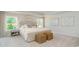 Bright bedroom featuring neutral decor, plush carpeting, large windows, and upholstered headboard at 723 Rupert Dr, Conway, SC 29526