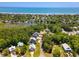 Panoramic aerial of homes near a lake and the ocean with lush surroundings at 77 Streater Ln., Pawleys Island, SC 29585
